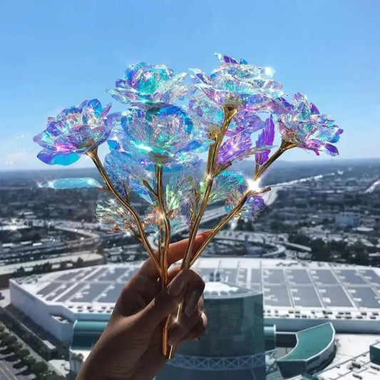 Iridescent glass galaxy rose with golden stems glowing in blue and purple by decorbites for wedding centerpiece