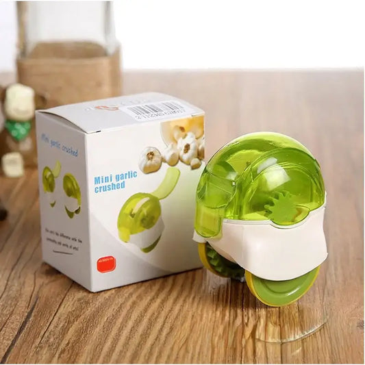 Transparent lime green and white plastic decorbites garlic chopper with rounded dome top for kitchen mincing tasks