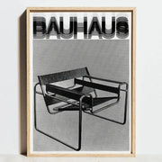 Black and white geometric bauhaus abstract canvas wall art featuring a minimalist light wood frame chair design by decorbites