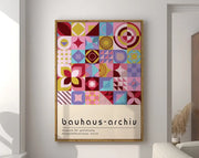 Framed decorbites™ geometric bauhaus canvas poster with vibrant pink yellow blue and purple abstract shapes on cream background