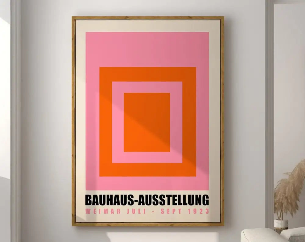 Framed geometric bauhaus canvas poster with pink and orange squares and black text on cream mat for modern decor