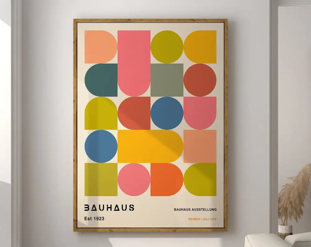A framed decorbites geometric bauhaus canvas poster with vibrant overlapping shapes in pink yellow blue and green for home decor