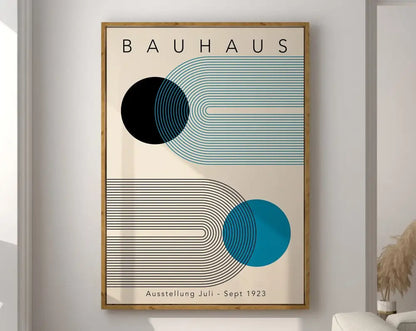 A framed DecorBites™ geometric bauhaus canvas poster with bold black and teal shapes on cream canvas in a light wood frame