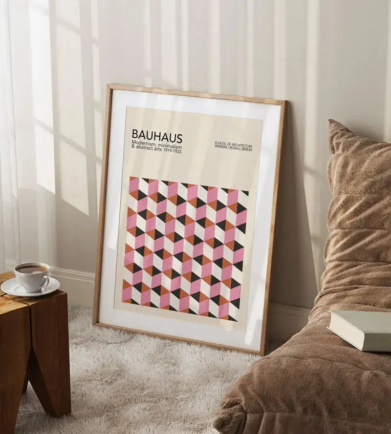 A framed decorbites™ geometric bauhaus canvas poster with pink black and beige tones for retro mid century wall art