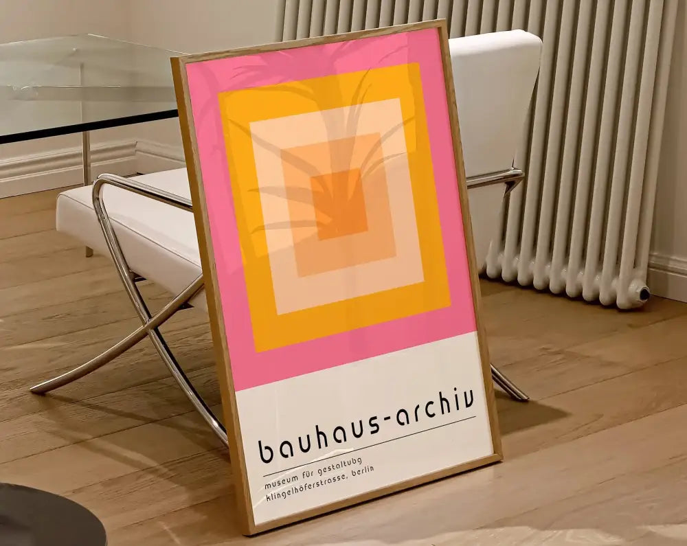 Framed decorbites™ geometric bauhaus canvas poster with concentric pink yellow and orange squares on white background