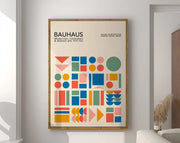 A framed DecorBites™ geometric bauhaus canvas poster with colorful shapes on an off-white background for wall art