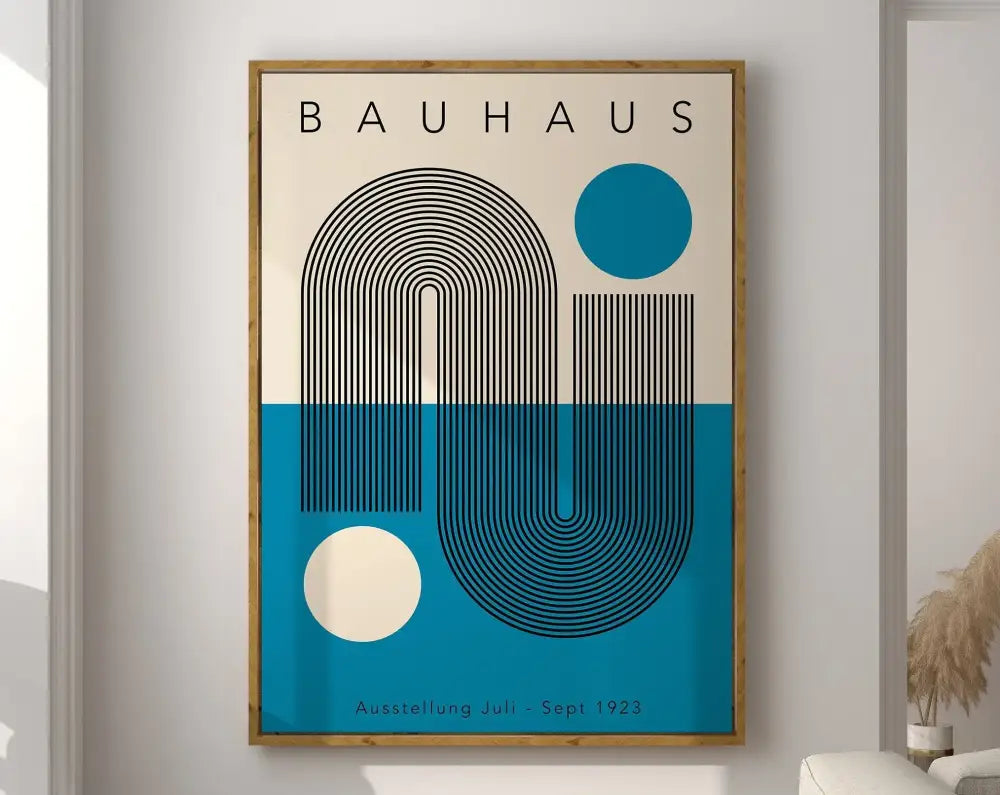 A framed DecorBites™ modernist Bauhaus canvas print with bold black curved lines on cream and teal in a light wood frame