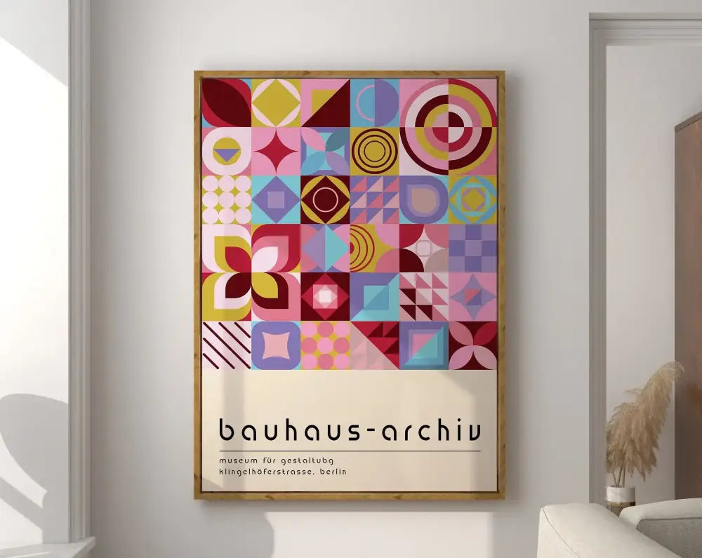 A framed decorbites™ geometric bauhaus canvas print with vibrant pink yellow blue and purple shapes for modern home