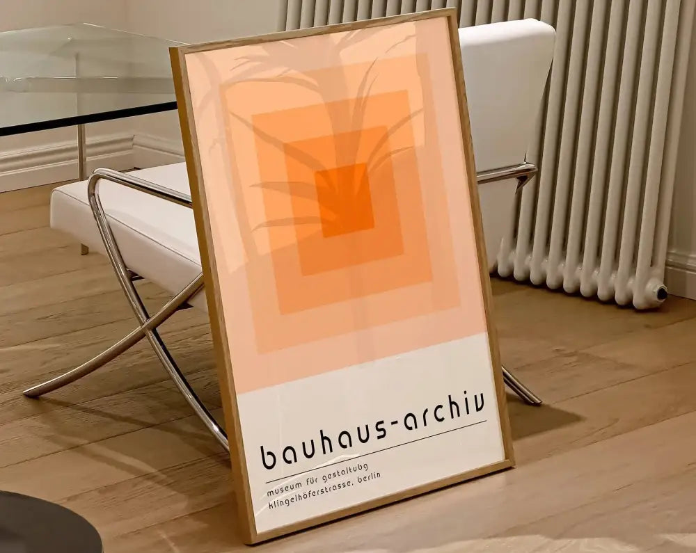 DecorBites™ geometric canvas print featuring concentric orange squares and palm leaf silhouette for modern home decor