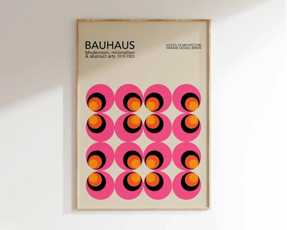 A framed decorbites™ geometric bauhaus canvas print featuring vibrant pink circles with orange and black rings on wall art