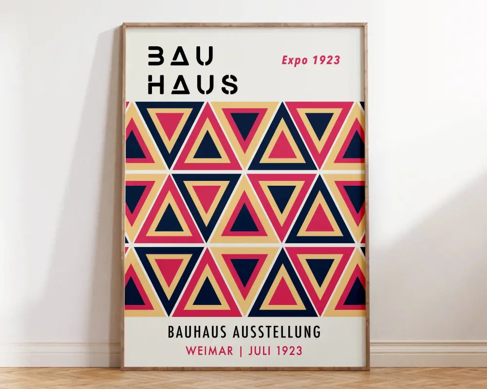 A framed decorbites™ geometric bauhaus wall art with navy blue coral pink and beige overlapping triangles for home decor