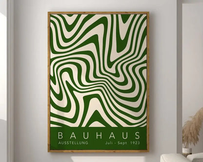 A framed decorbites™ geometric bauhaus canvas wall art with bold green and cream wavy lines in a light wood frame