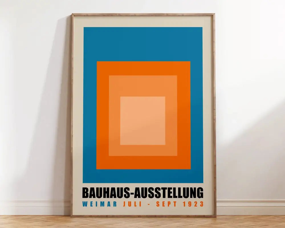 A framed decorbites™ geometric bauhaus canvas wall art featuring concentric blue orange and peach squares with bold text