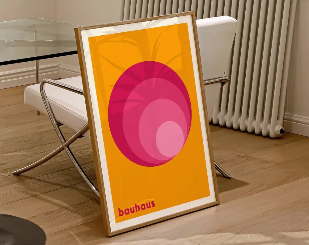 A framed decorbites™ geometric bauhaus canvas wall art with concentric pink circles on an orange background