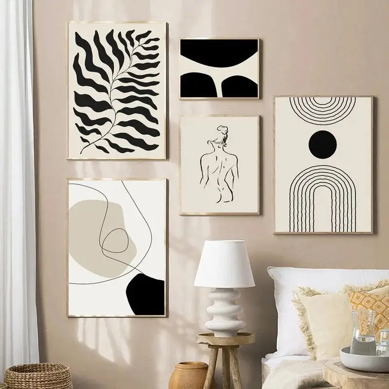 Minimalist black-and-white boho canvas wall art with geometric leaf rainbow design in thin wooden frames
