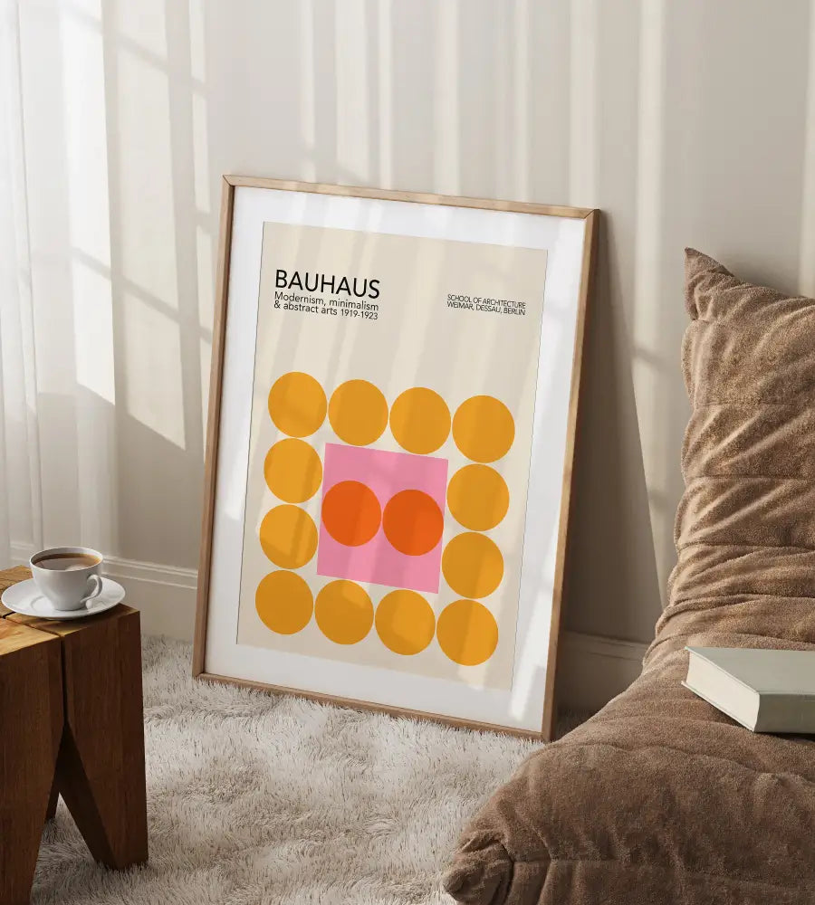 A framed decorbites™ geometric mid century bauhaus canvas wall art with yellow and pink circles on off-white background