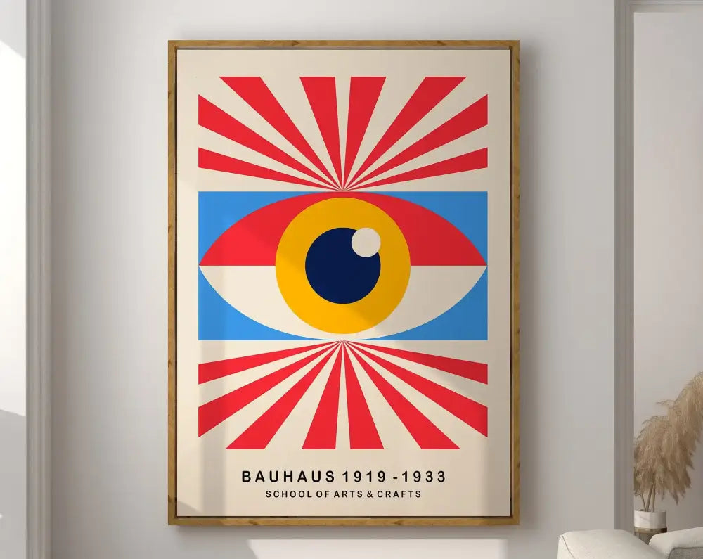 A framed decorbites™ geometric mid century canvas print featuring a bold bauhaus eye with red and blue rays on off-white background