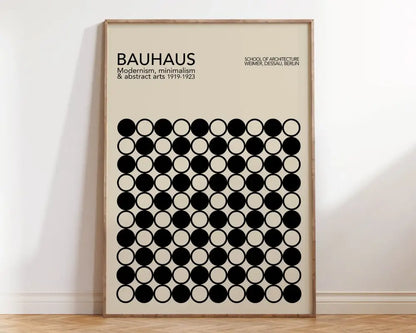 Beige bauhaus wall art with black circular patterns in light wood frame geometric canvas poster by decorbites