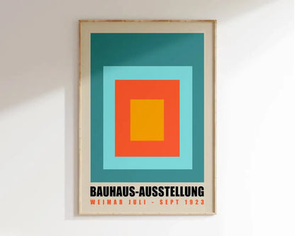 A framed bauhaus-style decorbites™ geometric canvas wall art featuring concentric teal, blue, orange, and yellow squares