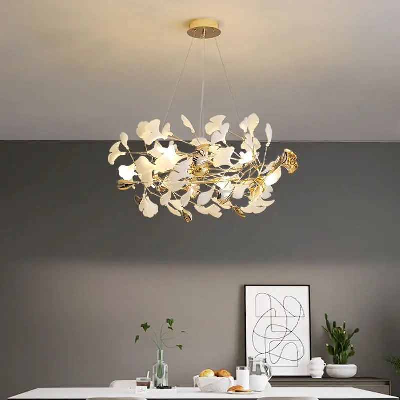 Decorbites ginkgo leaf chandelier with white and gold leaf elements and brass fixture for elegant nordic luxury lighting