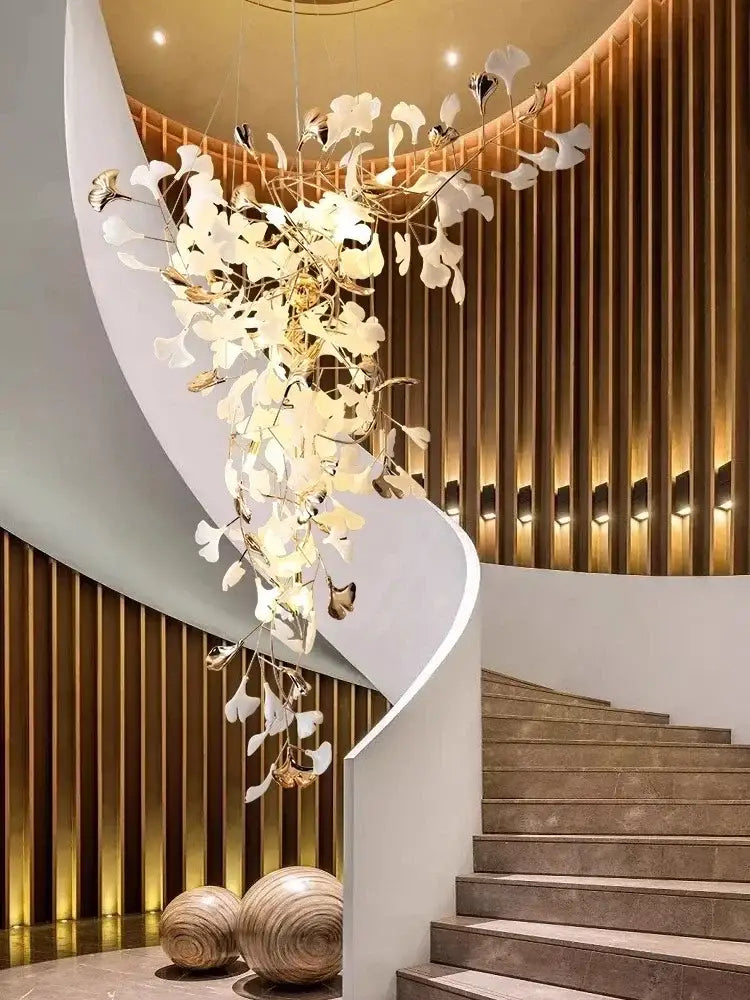 Decorbites ginkgo leaf chandelier featuring delicate white and gold leaf-shaped elements for luxury staircase and lobby lighting