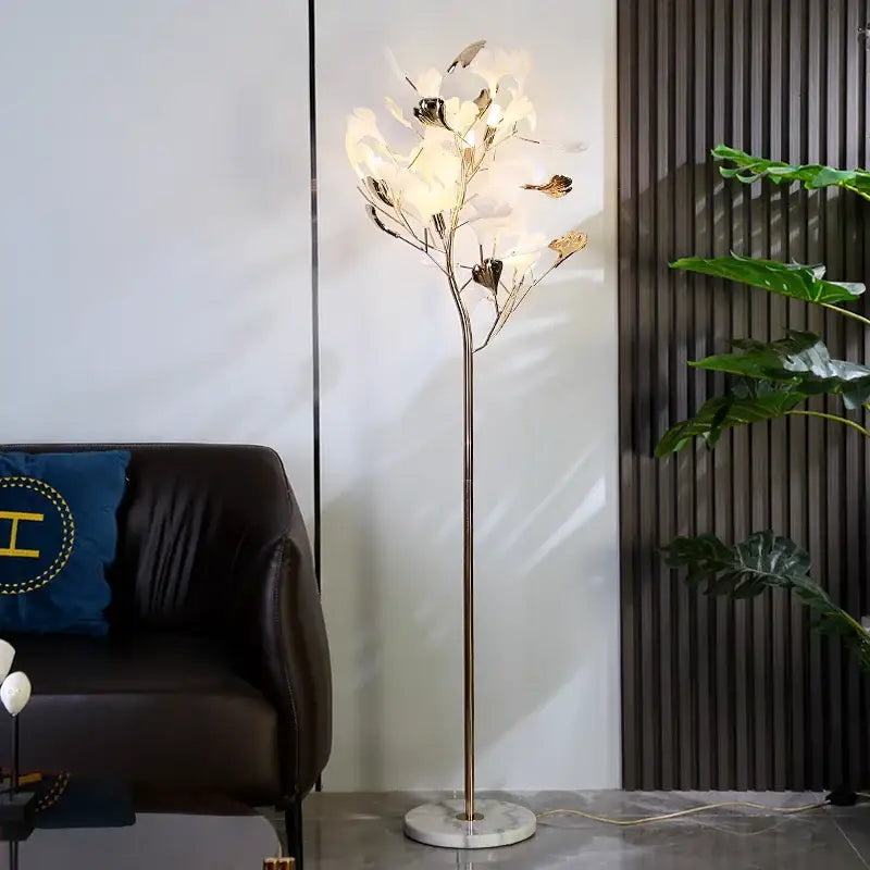 Modern decorbites ginkgo leaf floor lamp with slender metallic stem white and gold leaf shades on marble base