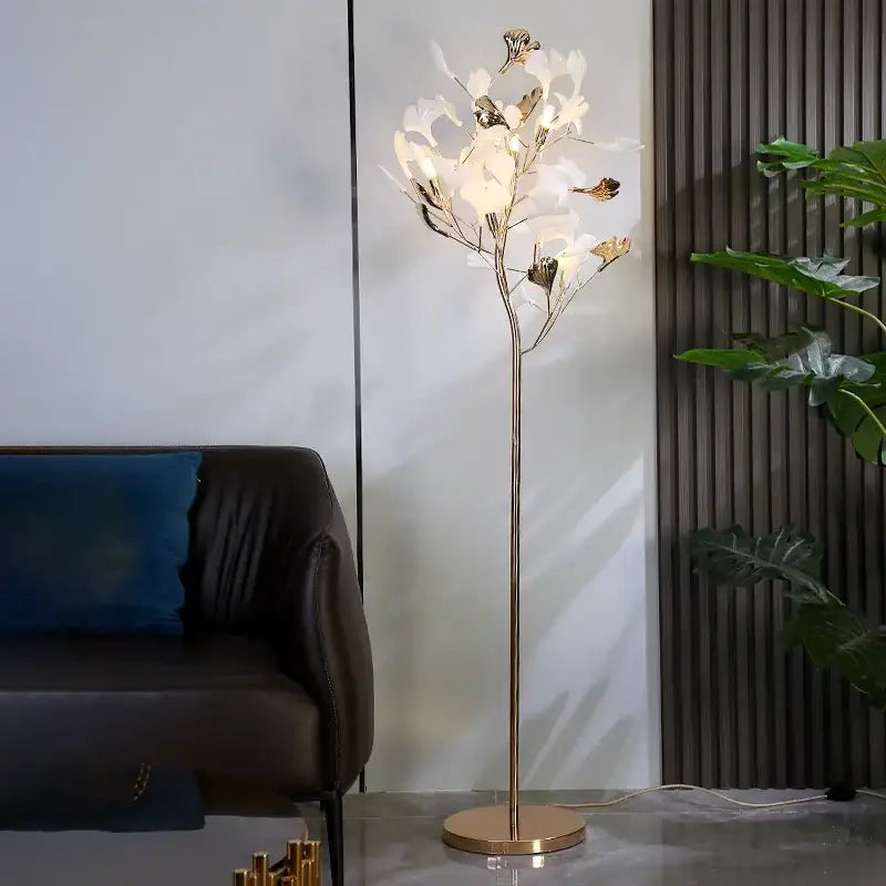 Elegant gold-toned DecorBites Ginkgo leaf floor lamp with white and metallic leaf lights for living room and bedroom use