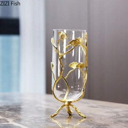 Elegant transparent glass vase with gold-toned ginkgo leaf metalwork on a three-legged base by DecorBites Ginkgo Leaf