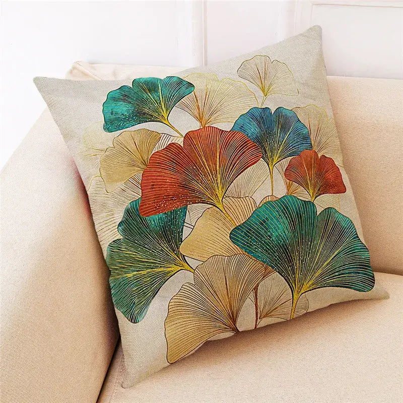 Beige linen cushion cover with vibrant teal rust and gold ginkgo leaves design for modern decor by DecorBites Ginkgo Leaves