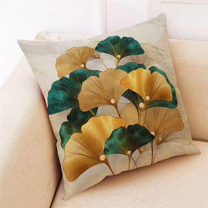Beige linen cushion cover with vibrant gold and teal ginkgo leaves and vein detailing for modern decorbites ginkgo leaves style