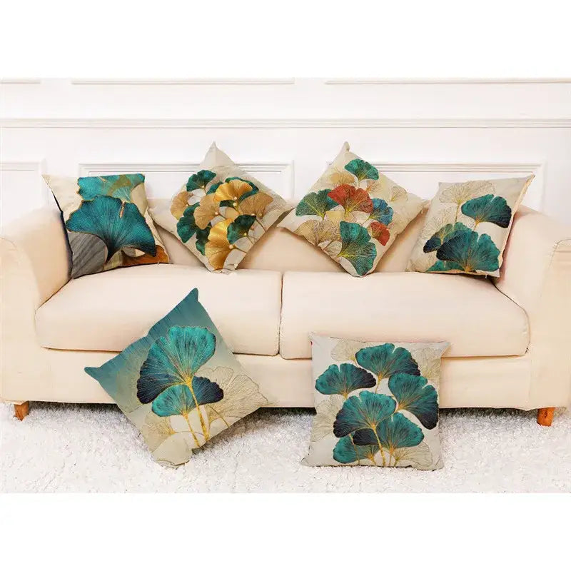 Set of six decorbites ginkgo leaves linen cushion covers with embroidered teal gold and earthy tones on beige fabric