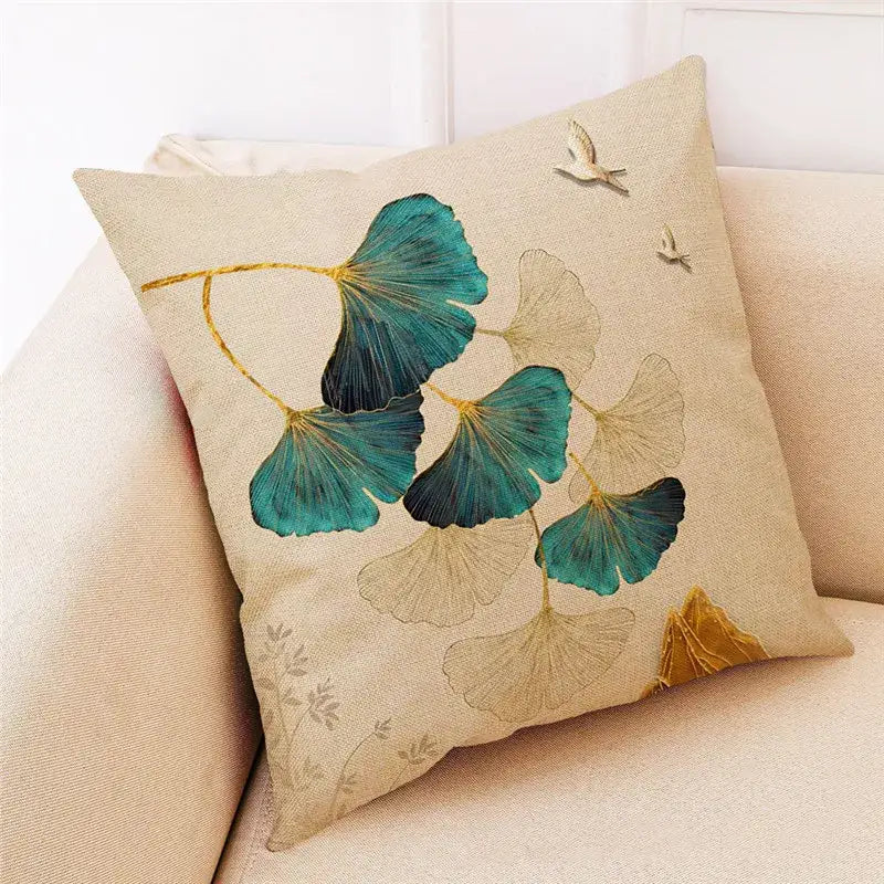 Beige linen cushion cover with teal and gold embroidered ginkgo leaves and bird appliqués by DecorBites Ginkgo Leaves