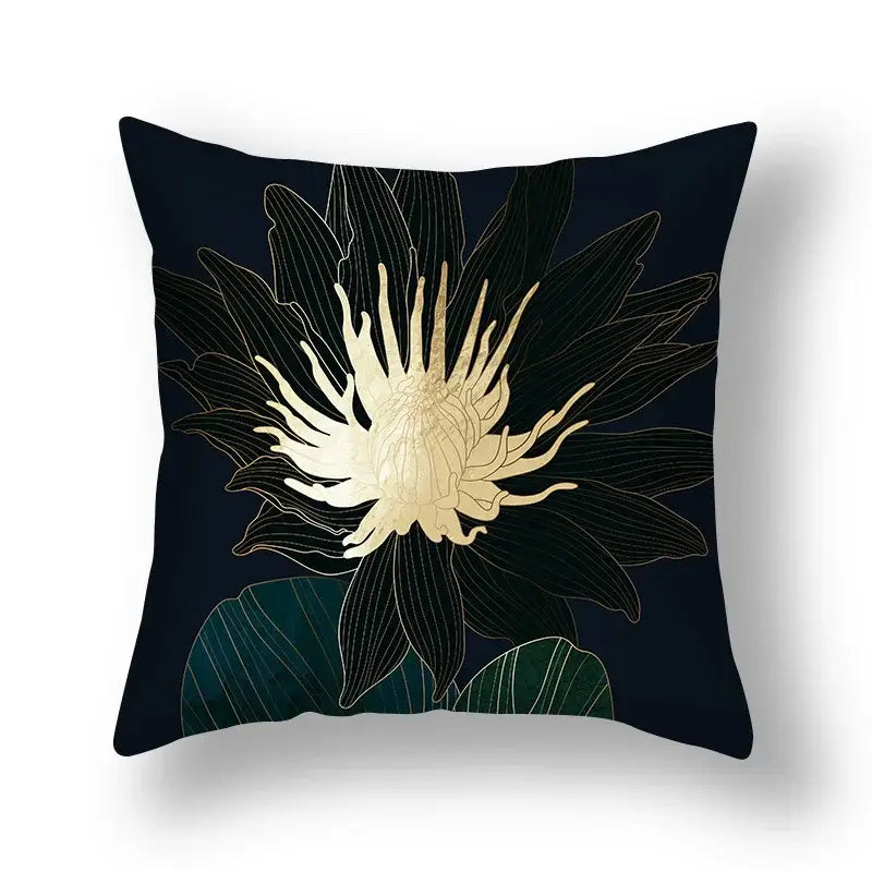 Black throw pillow with stylized gold lotus and dark green decorbites ginkgo leaves print for modern sofa use