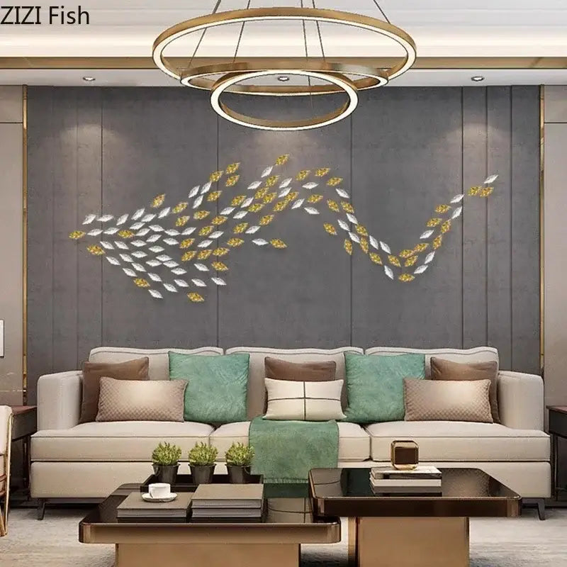 A modern metallic fish-shaped wall decor with alternating silver and gold leaf pieces by decorbites ginkgo leaves wall