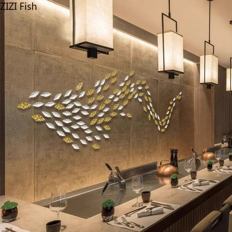 Decorbites ginkgo leaves wall decor featuring gold and silver metallic fish shaped art in a flowing school pattern
