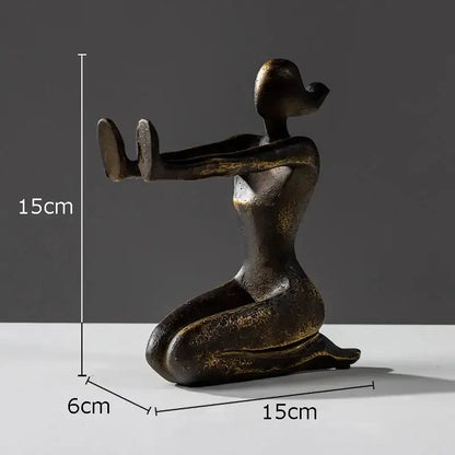 Bronze-colored abstract decorbites girl statue bookends featuring a kneeling woman with elongated limbs in resin