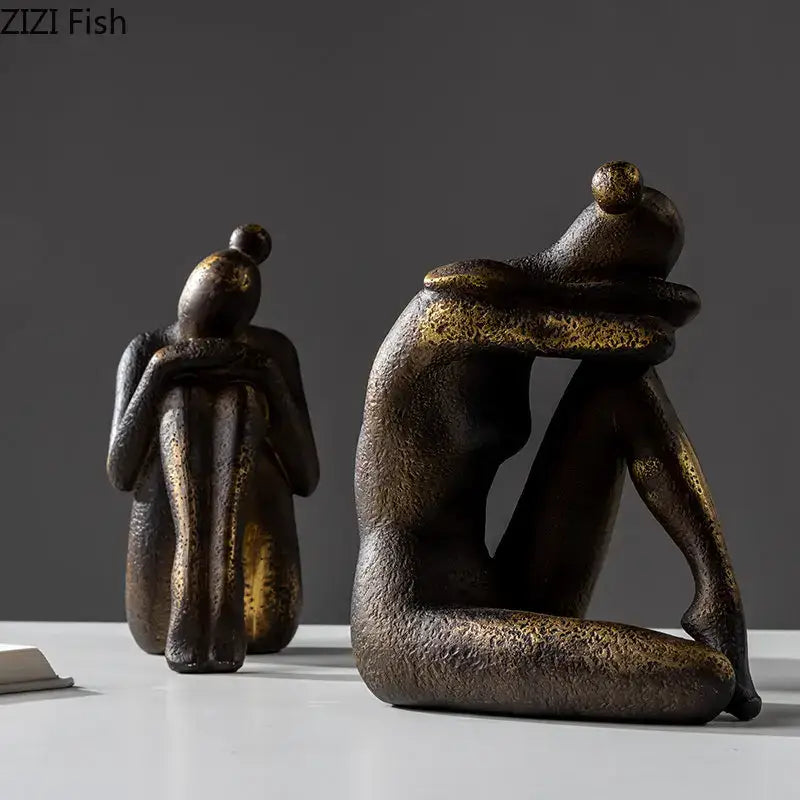 Bronze-finished decorbites girl statue bookends with textured golden resin surface for desk or bookcase decor