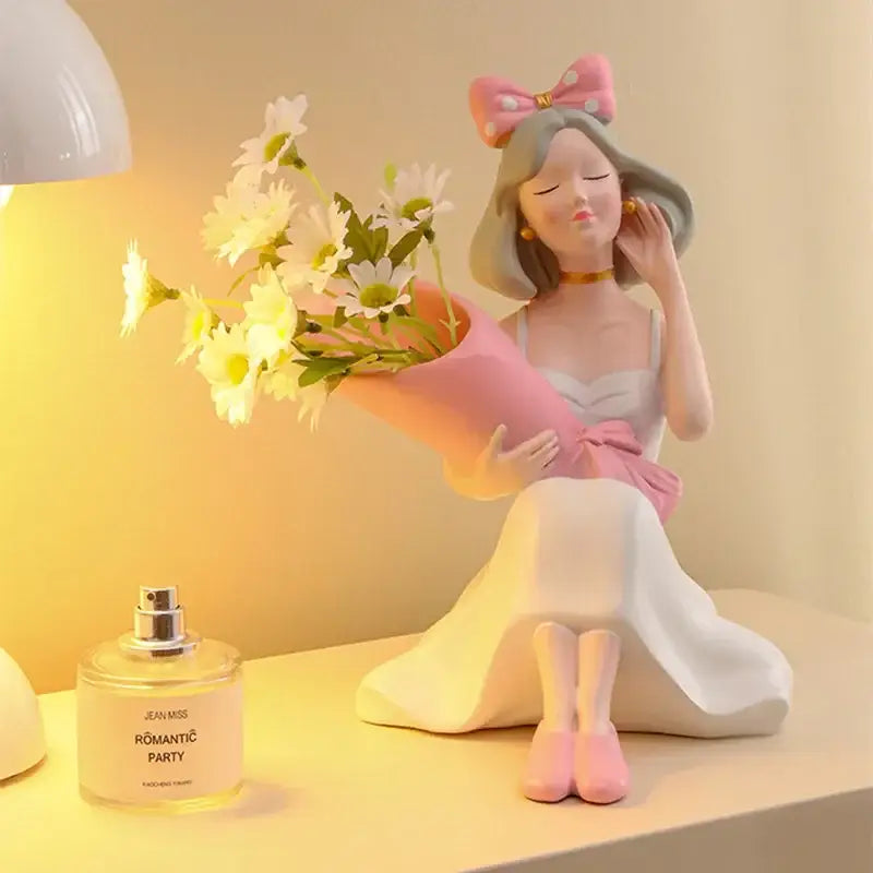 Pink and white resin decorbites girl statues vase ornament of seated woman holding daisies with gray hair bow