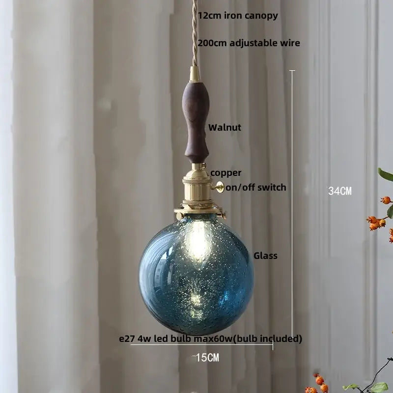 DecorBites™ Glabe glass blue textured pendant light fixture with walnut iron canopy and brass switch for modern spaces