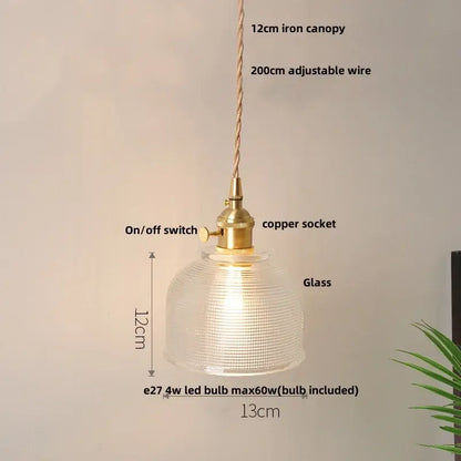 A warm-glowing decorbites glabe led pendant lamp with a textured translucent dome and brass-finished hardware