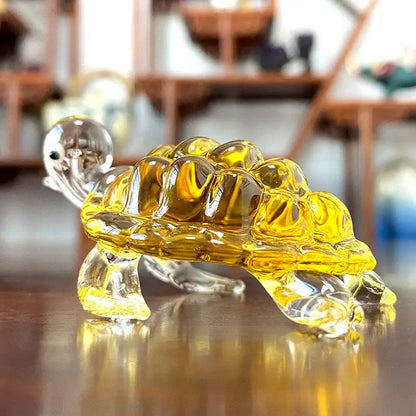A translucent yellow glass animal figurine turtle with clear head and limbs from DecorBites™ hand blown art collectibles