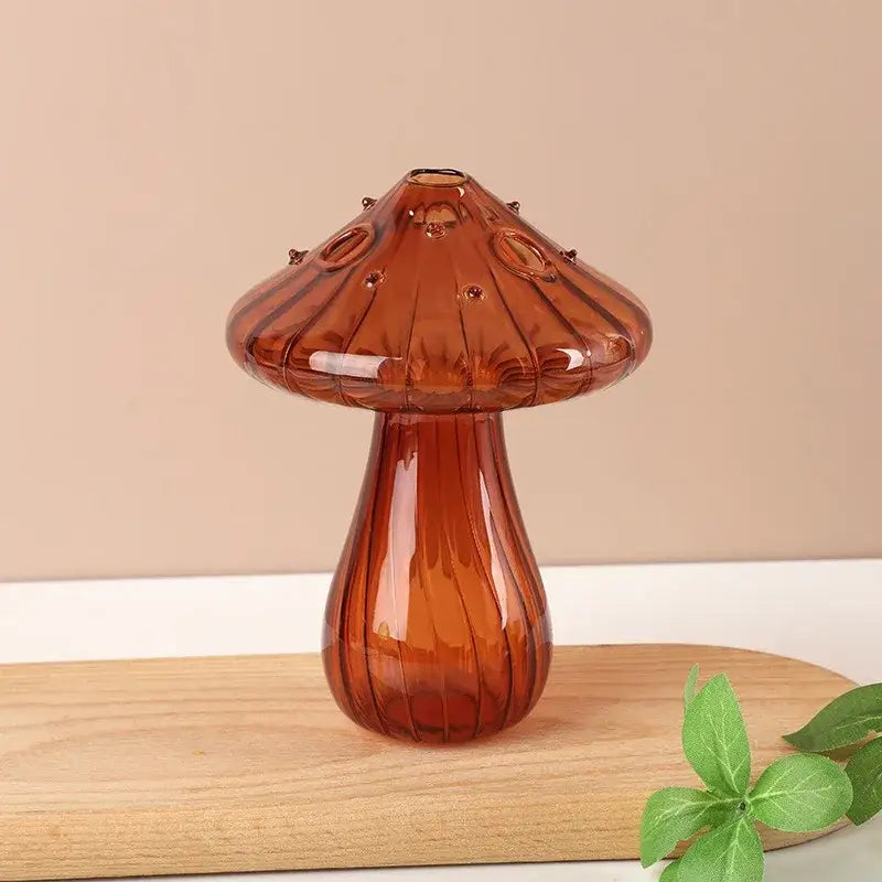 Amber-colored glass aromatherapy vase shaped like a ribbed mushroom with small circular details for home decor