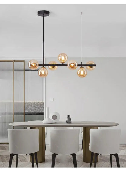 Modern black metal DecorBites™ ball ceiling chandelier with warm amber glass ball bulbs for dining room lighting