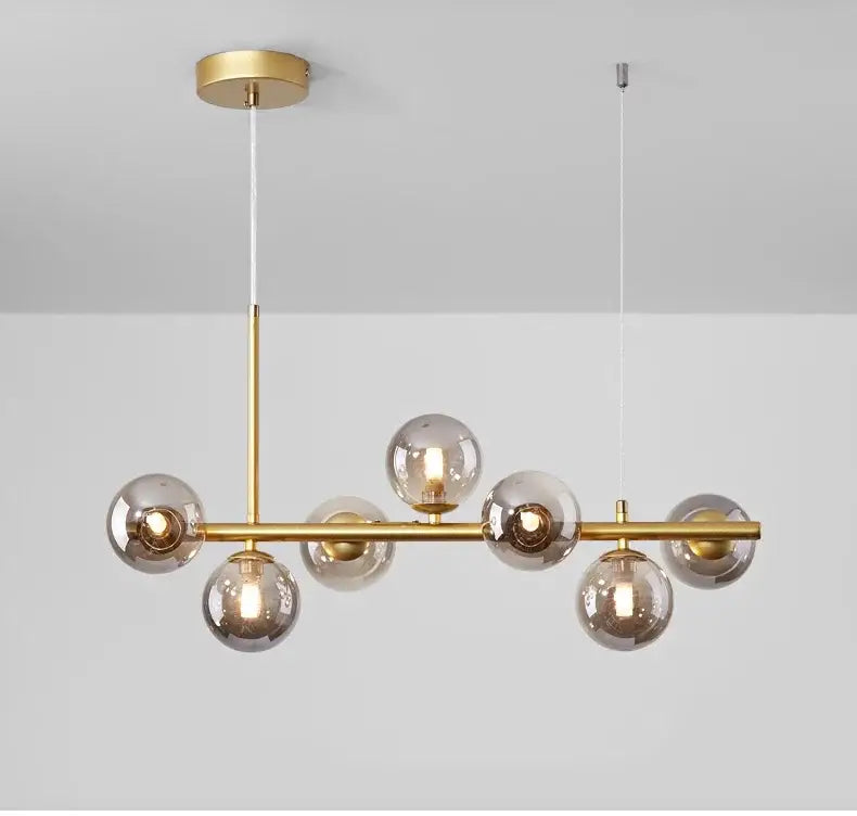 Gold-toned DecorBites™ ball ceiling chandelier with smoked glass spheres and sleek horizontal bar design for home lighting