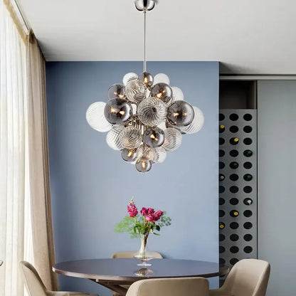 Modern decorbites glass ball ceiling chandelier with silver and clear glass spheres suspended from metallic rod