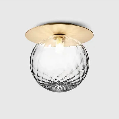 Aisel home ceiling light with decorbites glass ball featuring a hammered clear glass globe and polished brass base