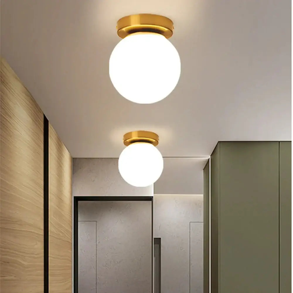 Gold-finished decorbites glass ball ceiling light fixture with frosted glass globes for modern bedroom decor