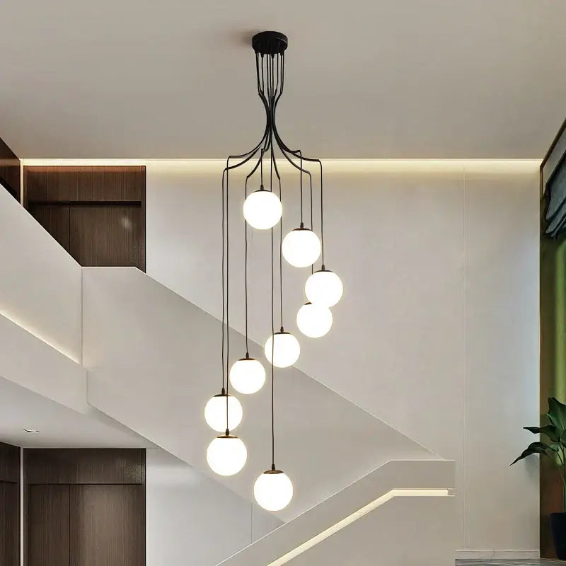 Modern black metal decorbites glass ball chandelier with seven glowing white spherical glass bulbs for dining room ceiling