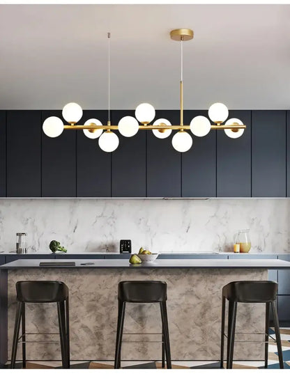 Modern gold-toned DecorBites™ glass ball chandelier with multiple white glass bulbs for living rooms and dining areas