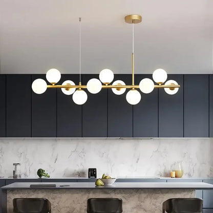 DecorBites™ glass ball chandelier with gold-toned frame and multiple white glass balls in linear modern design